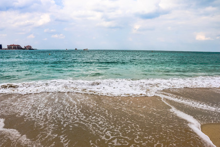 Horizon of Seascape, water waves at Jumeirah Beach under cloudy sky in Dubai, United Arab Emiratesの写真素材