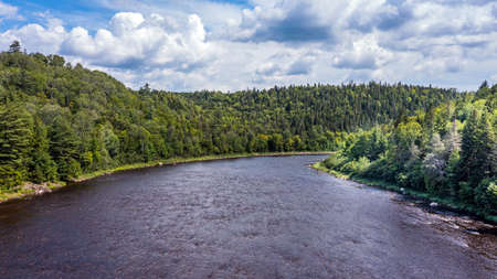 Drone View of Green Mountain Landscape, Summer Season in Canada, Water Stream flowing between...