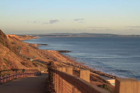 Looking out at the top of the Cliff Path towards the Isle of Wight  Taken in 2013 the huts visible are no-longer there  They were completely destroyed by the Winter Storms of 2013 14 の写真素材