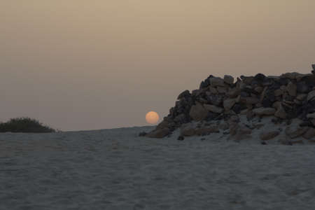 A stunning sunset on the beach の写真素材
