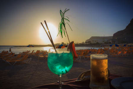Sunset with a drink at Amadores Beach in Gran Canaria の写真素材