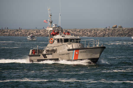 47 foot United States Coast Guard Motor Life Boat on patrol in the Tillamook Bay just inside of the Tillamook, Oregon, bar where numerous boats have sunk and lives have been lost. Taken on 09/10/2017.のeditorial素材