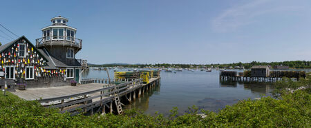 A fishing pier stretching out into the lake.の写真素材