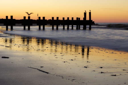 The sun setting over the ocean.の写真素材