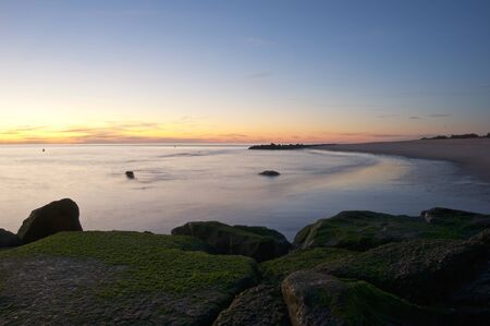 The sun setting over the ocean.