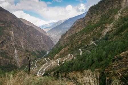A road winding its way down the mountain side.の写真素材