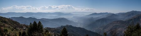 A panorama of the lows hills shrowded in the morning mists.の写真素材