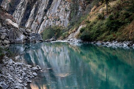 An aqua colored river flowing through a canyon.の写真素材