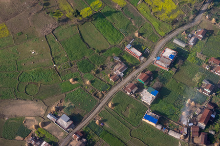 A beautiful aerial view of farmland and buildings in the country of Nepal.
