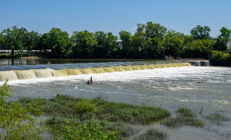 Zanesville, Ohio - August 4, 2019:  People fishing in the river in Zanesville, Ohio on August 4, 2019.のeditorial素材