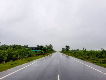 A wet stormy day while driving on the road.