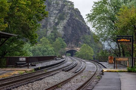 The railroad tracks in Harpers Ferry, West Virginia with the mountains in the background.