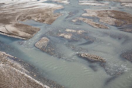 An aerial view of water flowing in a riverbed.