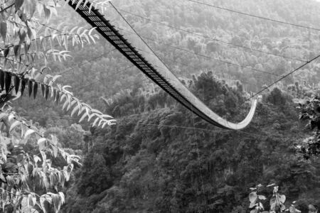 Kushma - Gyadi suspension bridge is the highest and longest suspension bridge in Nepal. It is 1,128 feet long and 384 feet above the Modi river in central Nepal.の写真素材