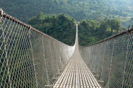 Kushma - Gyadi suspension bridge is the highest and longest suspension bridge in Nepal. It is 1,128 feet long and 384 feet above the Modi river in central Nepal.の写真素材