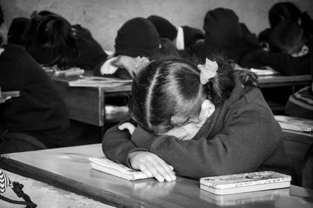 Kathmandu, Nepal - February 4, 2020: School students sitting in a classroom  listening to the teacher in Kathmandu, Nepal.のeditorial素材