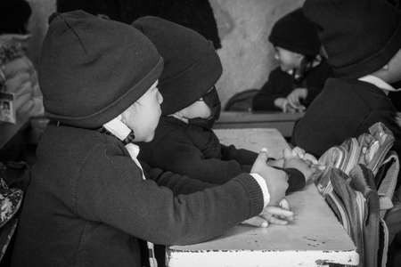 Kathmandu, Nepal - February 4, 2020: School students sitting in a classroom  listening to the teacher in Kathmandu, Nepal.のeditorial素材