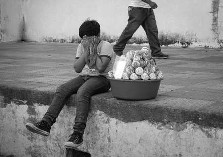 Managua, Nicaragua - January 11, 2018: Boy selling sweets in Managua, Nicaragua on January 11, 2018.のeditorial素材