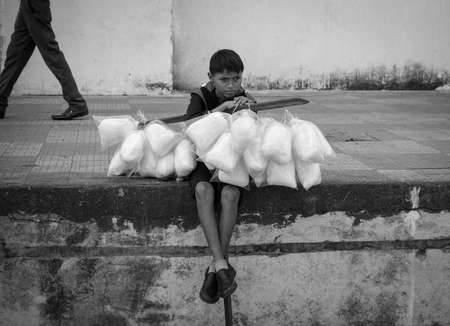 Managua, Nicaragua - January 11, 2018: Boy selling sweets in Managua, Nicaragua on January 11, 2018.のeditorial素材