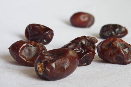 Some dates laying on a white background.の写真素材