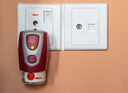 A Liquid Mosquito Repellent device plugged into a power outlet.