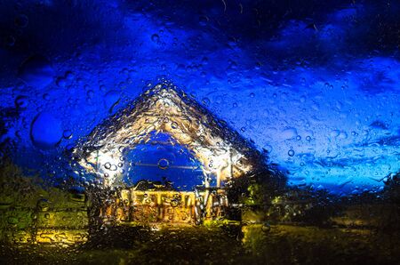 An abstract colored background covered with water droplets.の写真素材