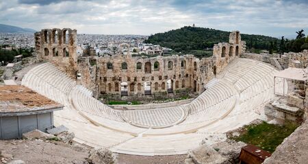 An amphitheater in Athens, Greece under a cloudy sky from a high angle.の写真素材