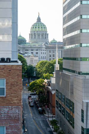 Harrisburg, Pennsylvania - July 18, 2020: The Harrisburg capital building at the end of a street between two skyscrapers.のeditorial素材