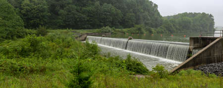 A dam designed to control the flood waters in the rural area.