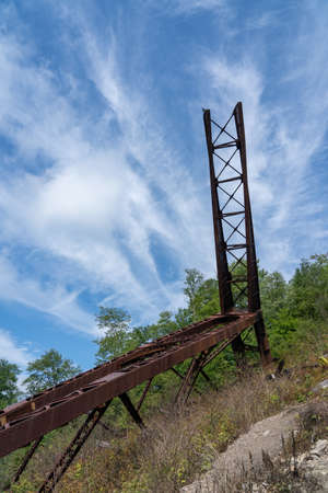 A giant girder of the destroyed Kinzua Bridge sticking up into the sky.の写真素材