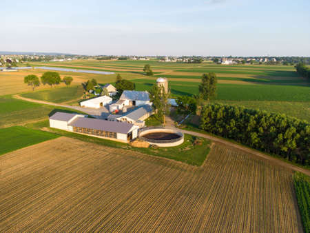 An aerial view of farms and farmland in the rural countryside.