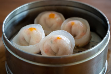 Four pieces of Dim Sum in a Metal pan.の写真素材