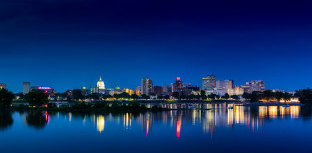 Harrisburg, Pennsylvania - July 4, 2022: The color and beauty of the Harrisburg Capitol city lights reflecting on the Susquehanna River.のeditorial素材