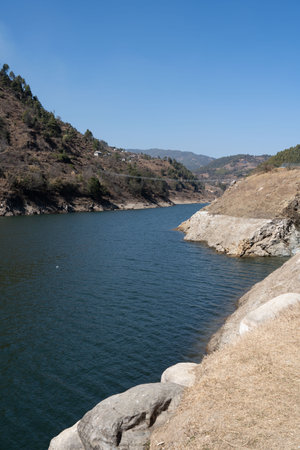 A low angle view of the Kulekhani Lake and the swinging bridge.