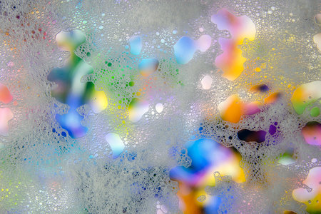 Abstract background of soap foam. Shampoo bubbles on the window.の写真素材