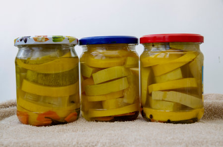 Glass jars with marinated zucchiniの写真素材