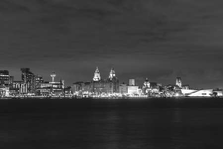 Liverpool at night taken from the Wirral. Both Cathedrals and the Three Graces can all be seen from the view.の写真素材