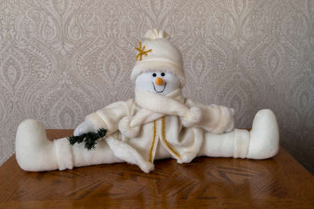 Snowman door stop at Christmas sitting on table, Taken in KIngs Lynn, Norfolk, UK, on 23rd Dec 2019.のeditorial素材