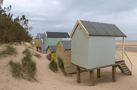 Different view of the beach huts under a gloomy sky on the beach at Wells-Next-Sea in Norfolk.の写真素材