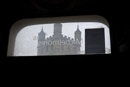 The Michelmores sign backwards on a window at Occupy Exeter site