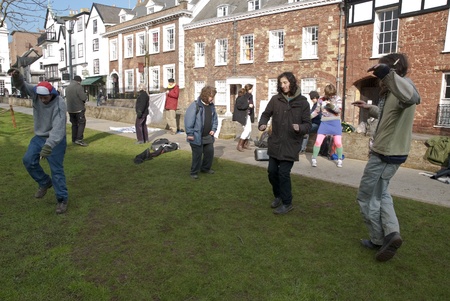Exeter Occupy activists dance on Exeter Cathedral Green during their official leaving event from their occupy camp. のeditorial素材