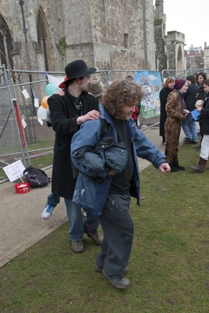 Occupy Exeter activist take part in a conga during the Occupy Exeter leaving the Exeter Cathedral Green event in Exeter.のeditorial素材