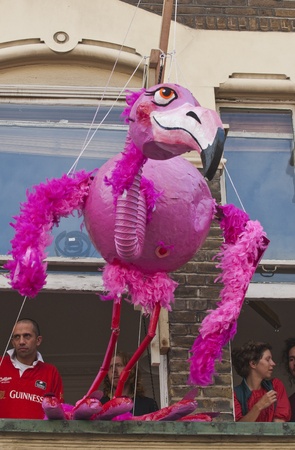 A giant flamingo puppet hanging from an apartment window at the Notting Hill Carnival on August 30, 2010 in Notting Hill, London. のeditorial素材