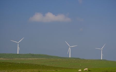Three white windmills generating electricityの写真素材