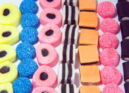 Background pattern made from sweets in linesの写真素材