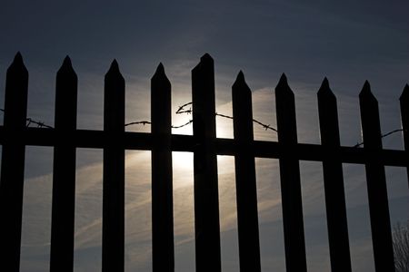 Security fencing keeping people out/inの写真素材