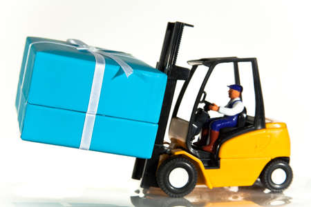 A toy forklift truck delivering a wrapped presentの写真素材
