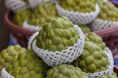 Cherimoya (Also Spelled Chirimoya) Fruit on display at a local market in Taiwan. This delicious...