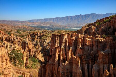 Earth Forest of Yuanmou in Yunnan Province, China - Exotic earth and sandstone formations glowing in the sunlight. Naturally formed pillars of rock and clay with unique erosion patterns. China Travelの写真素材