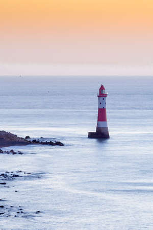Beachy Head Light House and Chalk Cliffs at Sunrise, Sussex, England, UKの写真素材